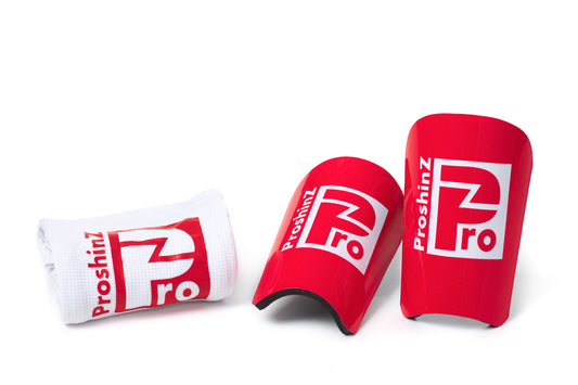 Red shin pads with white sleeve