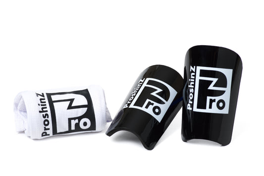 Black shin pads with white sleeve