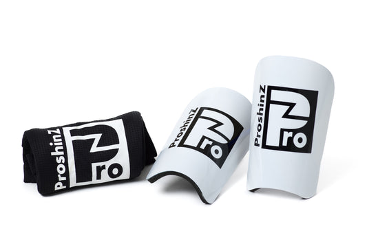 White shin pads with black sleeve